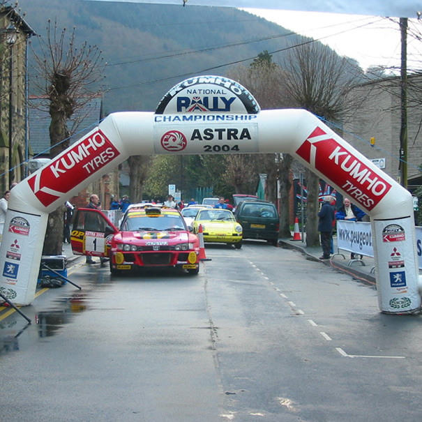 large white inflatable arch with Kumho Tyres branding at the Astra National Rally Championship start line