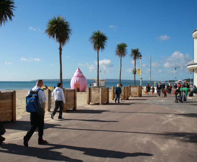 Bournemouth promenade with pink inflatable shell beyond