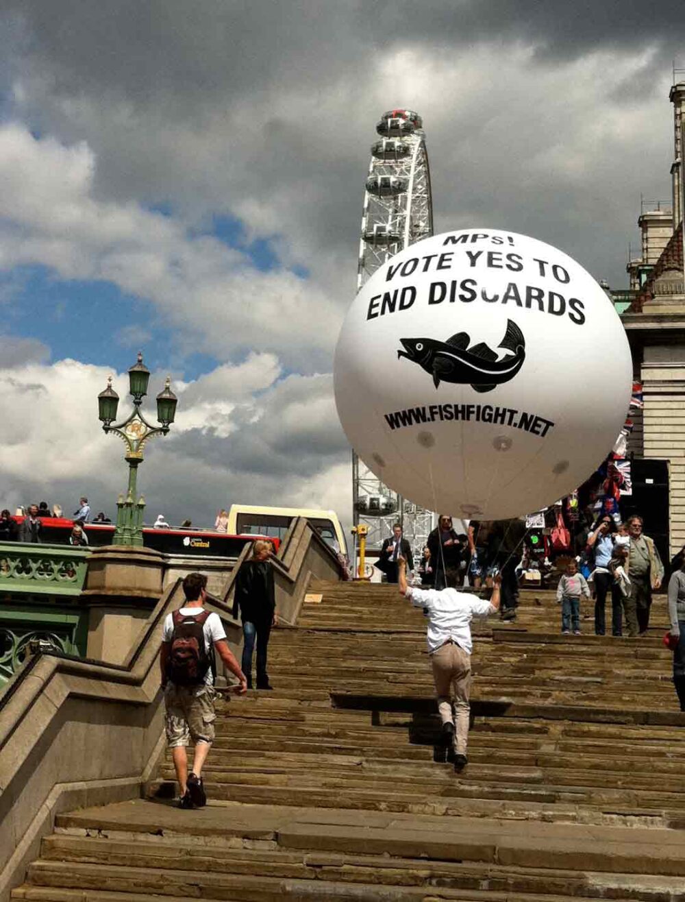 FishFight campaign sphere being carried up steps near London Eye