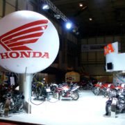 Honda sphere supported above exhibition stand