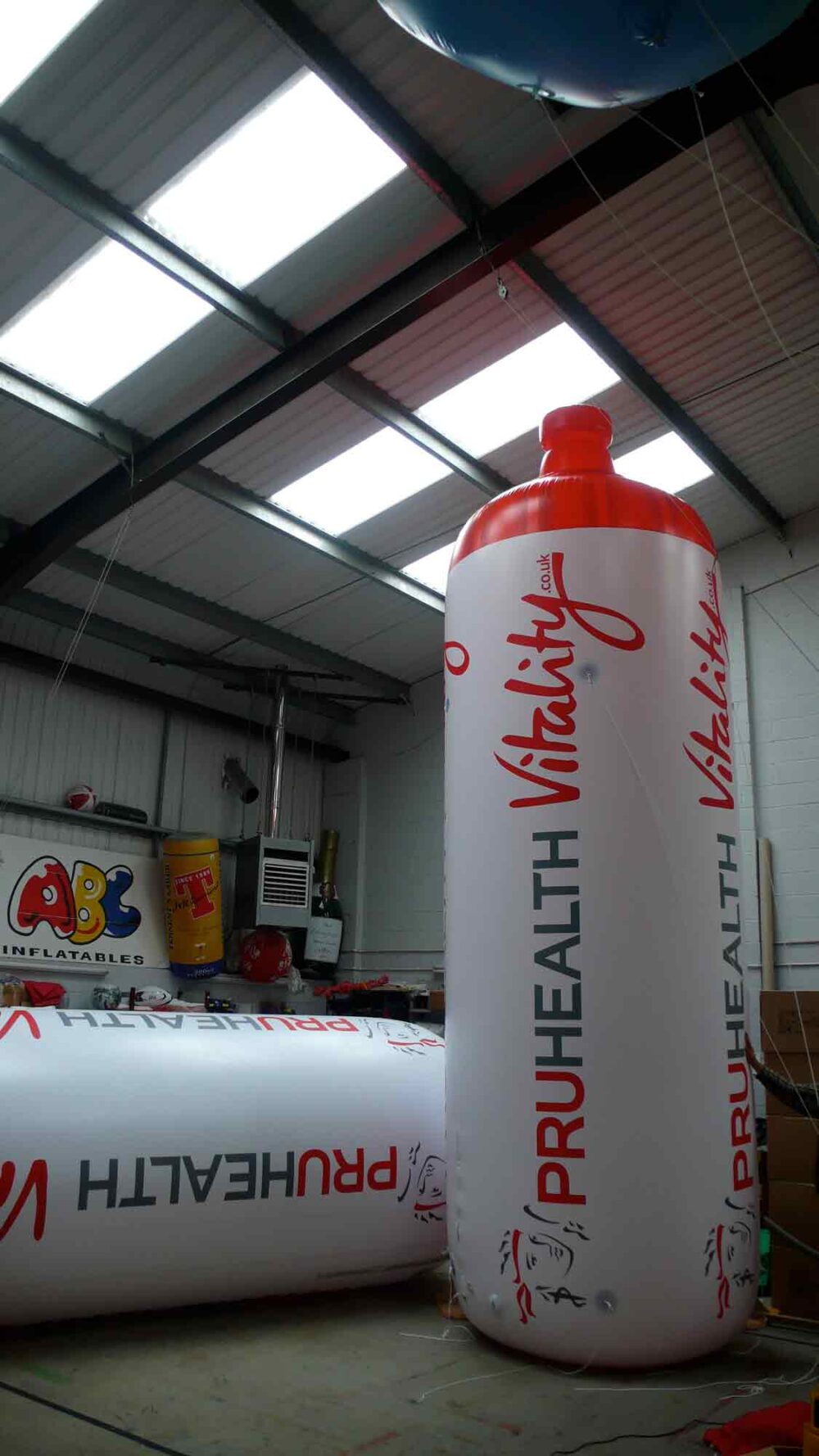 2 giant inflatable replica water bottles branded PruHealth