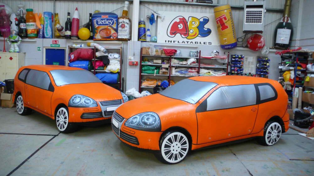 Life-sized inflatable orange cars