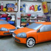Life-sized inflatable orange cars