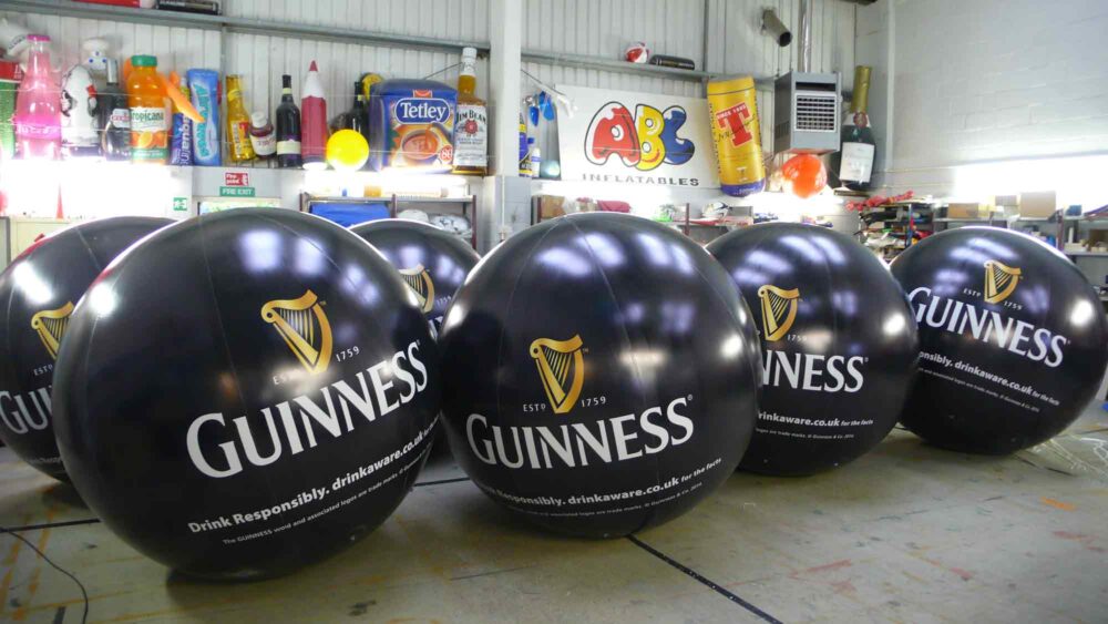 6 giant branded Guinness pushballs in ABC Inflatables workshop
