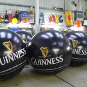 6 giant branded Guinness pushballs in ABC Inflatables workshop