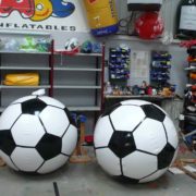 2 large replica footballs inflated in our workshop