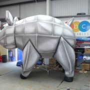 Grey robotic looking giant inflatable pig in our workshop