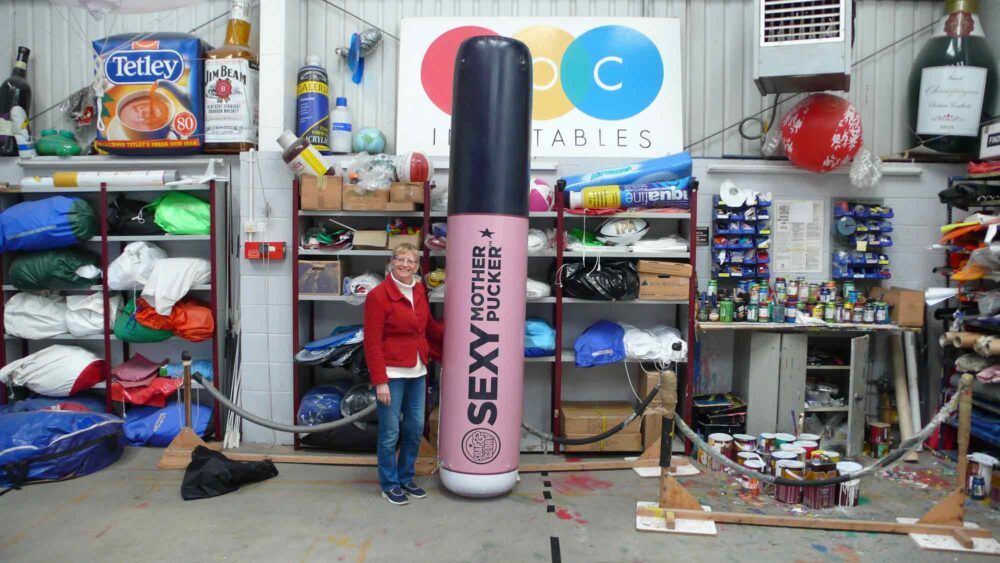 Giant product replica inflatable Sexy Mother Pucker lipstick with lady in workshop