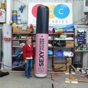 Giant product replica inflatable Sexy Mother Pucker lipstick with lady in workshop