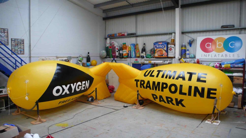2 yellow airship site markers for Oxygen Trampoline Park