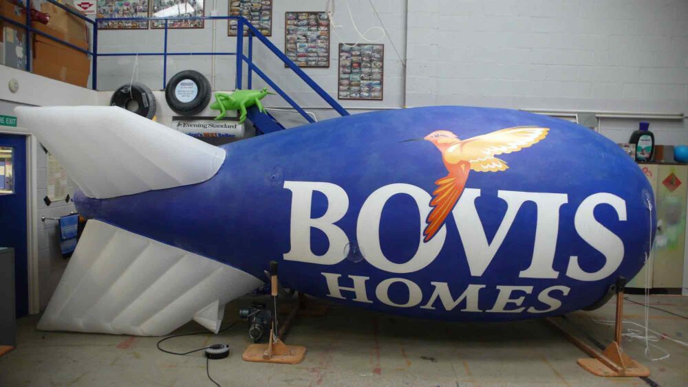Artwork with bird for Bovis Homes on a blue and white blimp
