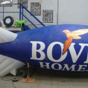 Artwork with bird for Bovis Homes on a blue and white blimp