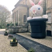 giant inflatable rabbit emerging from top hat
