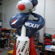 Wolfy character holding Dafy Moto exhaust