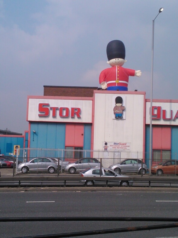 inflatable guardsman standing on roof
