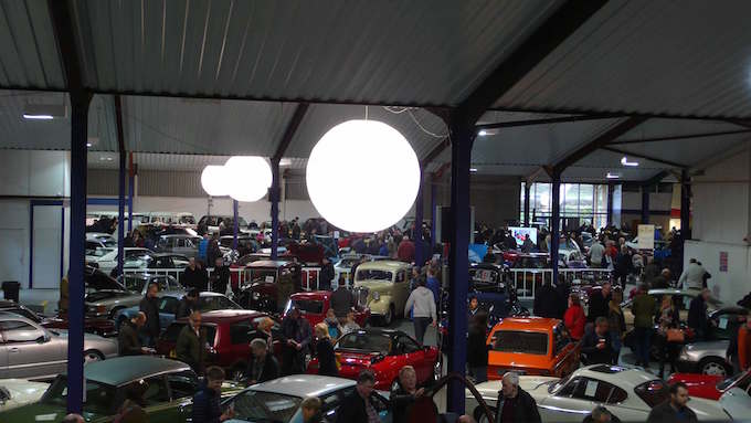 an auction of classic cars illuminated by ABC Inflatables light balloons