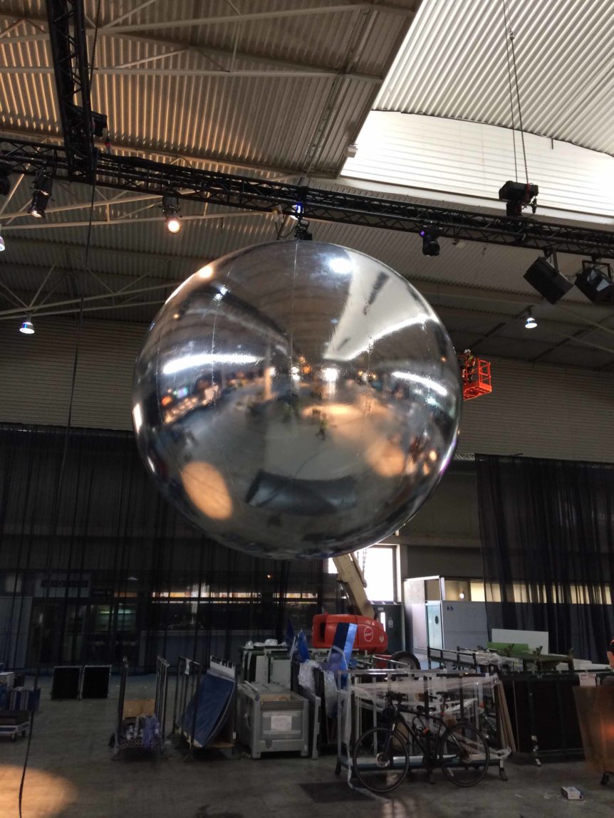 Giant mirror ball suspended over exhibition