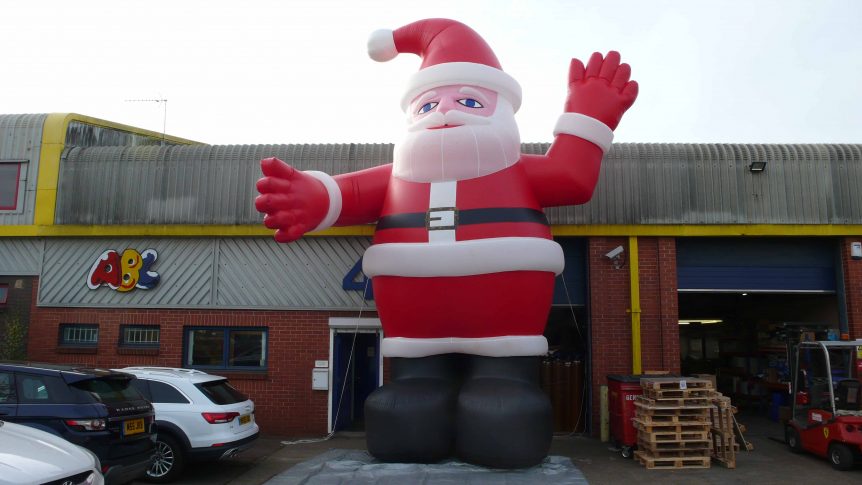 giant inflatable Father Christmas in front of the ABC Inflatables office